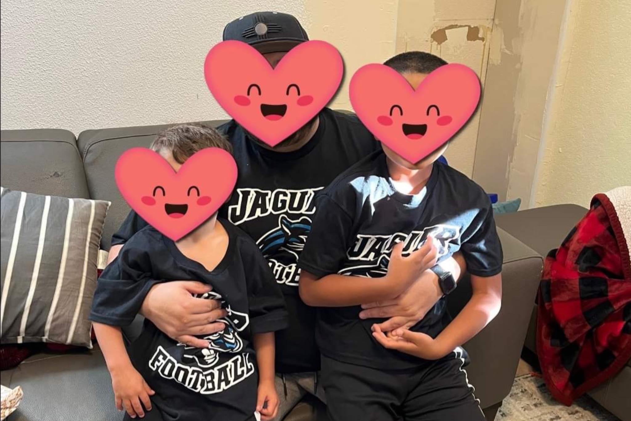 kiki 1 family with smiling heart emojis over faces