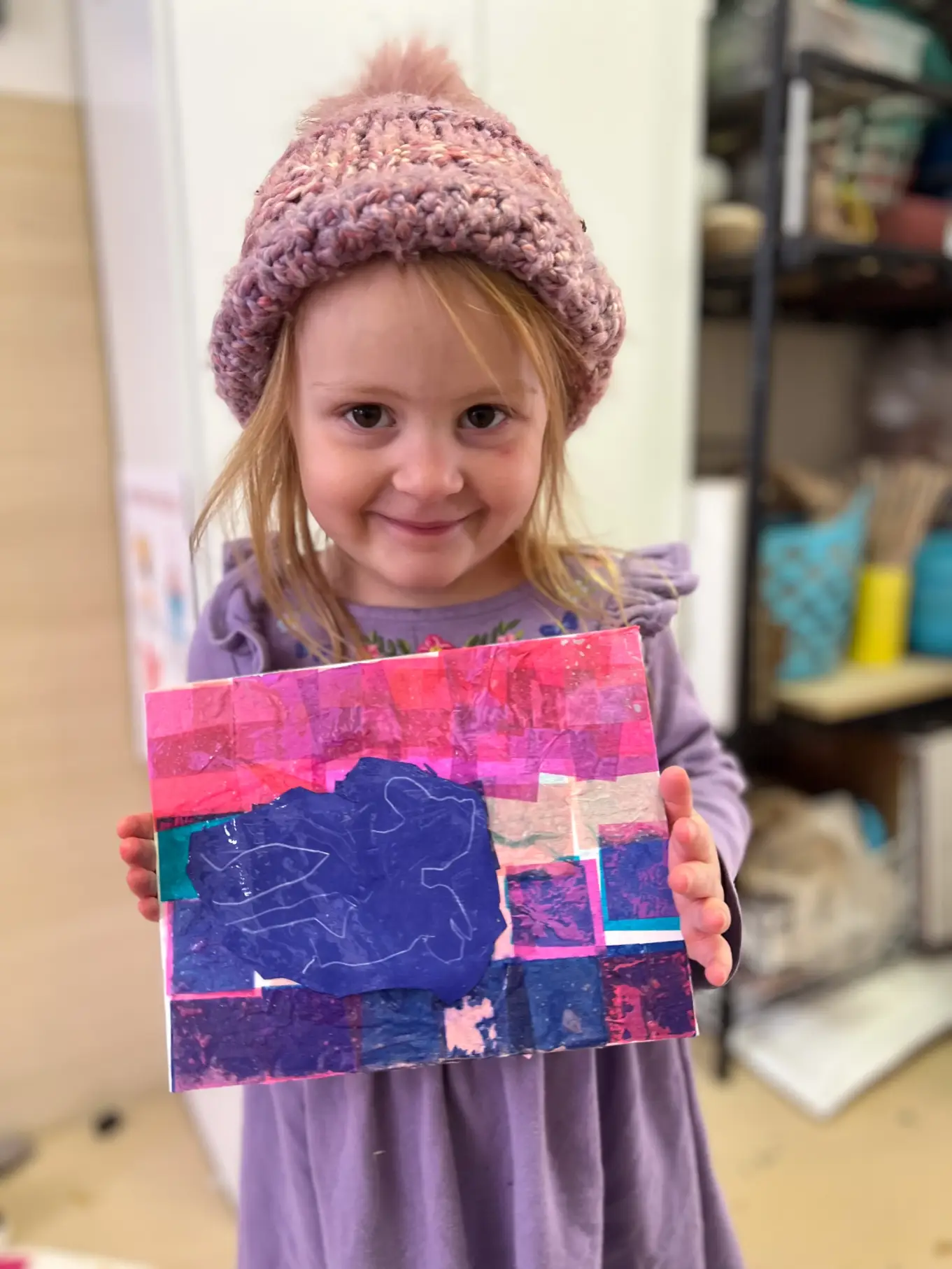 Young artists displaying her painting